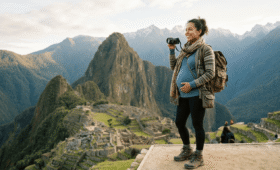 Pregnant traveler enjoying the view of Machu Picchu during a safe trip to Peru.